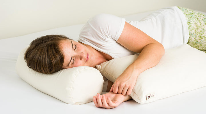 Woman sleeping with buckwheat pillows
