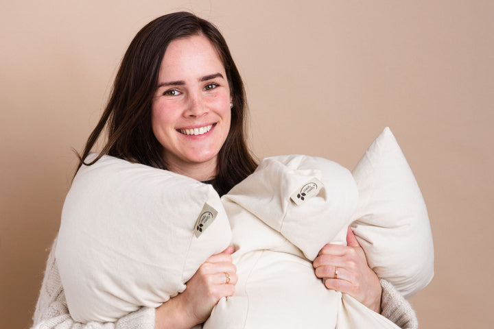 woman holding comfycomfy buckwheat hull pillows