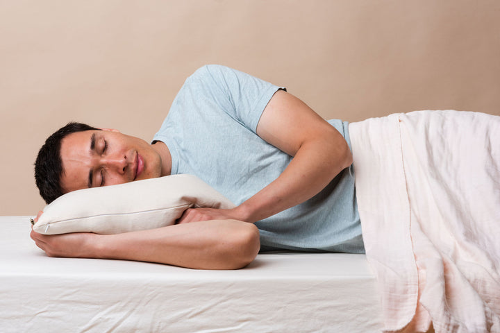 Man sleeping on a comfycomfy buckwheat hull pillow restful supportive sleeping side sleeper