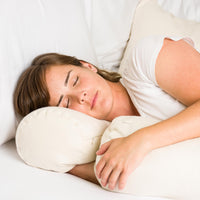 Woman sleeping with ComfyComfy buckwheat hull ComfyNeck Pillow